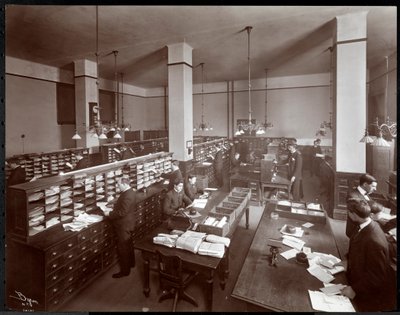 Young men working in a mailroom at the Metropolitan Life Insurance Co. at 23rd Street and Madison Avenue, New York, 1907 by Byron Company